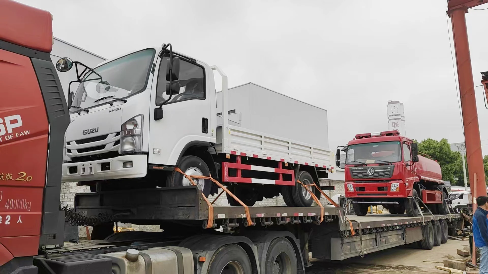 Historical special vehicles secured on a road transporter in the company archive